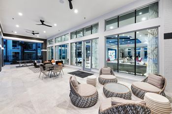 A spacious room with a white ceiling and a glass wall.